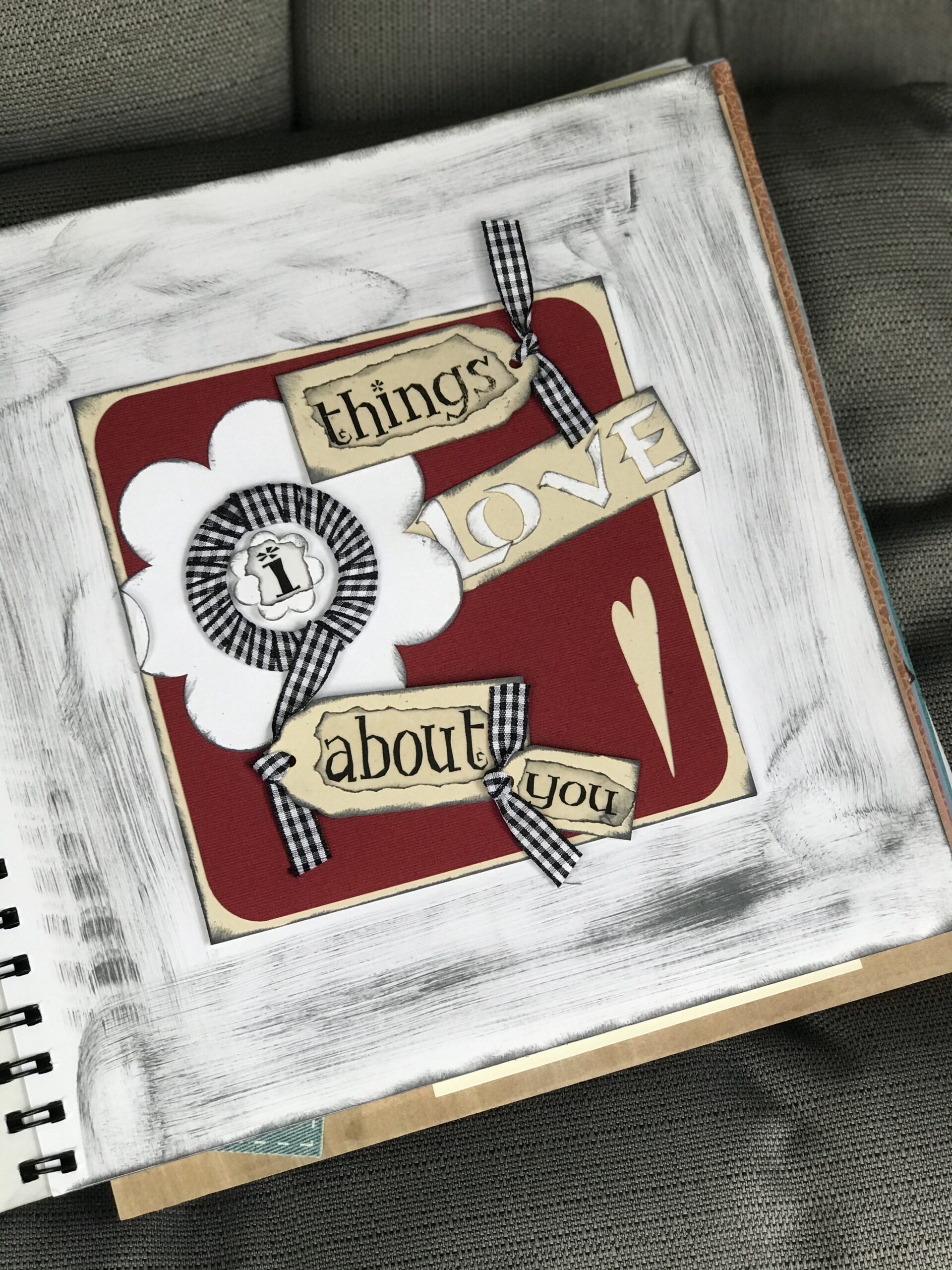 Photo albums spread on table